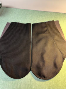 a pair of black pocket bags made up
