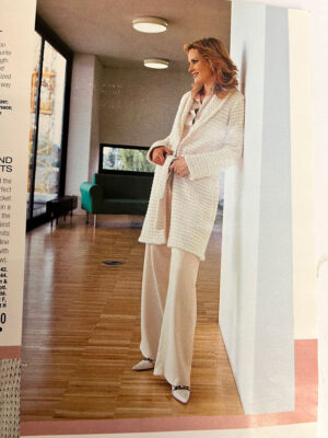 Burda magazine page with model wearing white cardigan and trousers