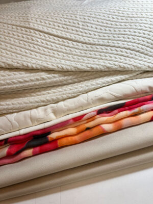 stack of fabrics cuts in shades of white