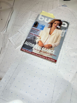 Burda magazine laying on top of pattern stack