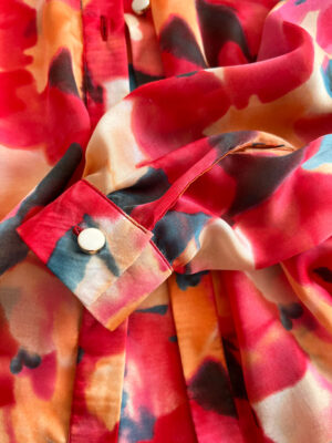 calf detail on a printed silk blouse