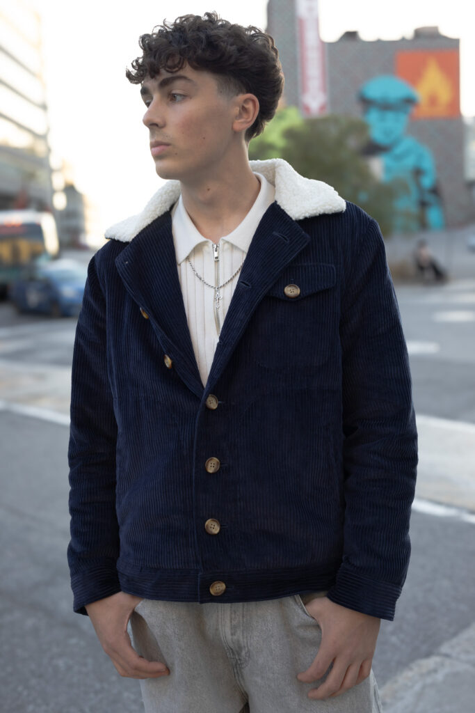 Navy corduroy jacket with white faux fur lining and collar