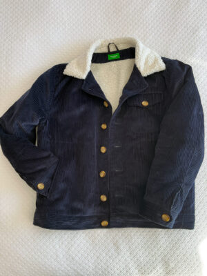 Navy corduroy jacket laying flat on white background