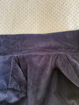 Blue corduroy jacket under collar and collar stitched to folding line